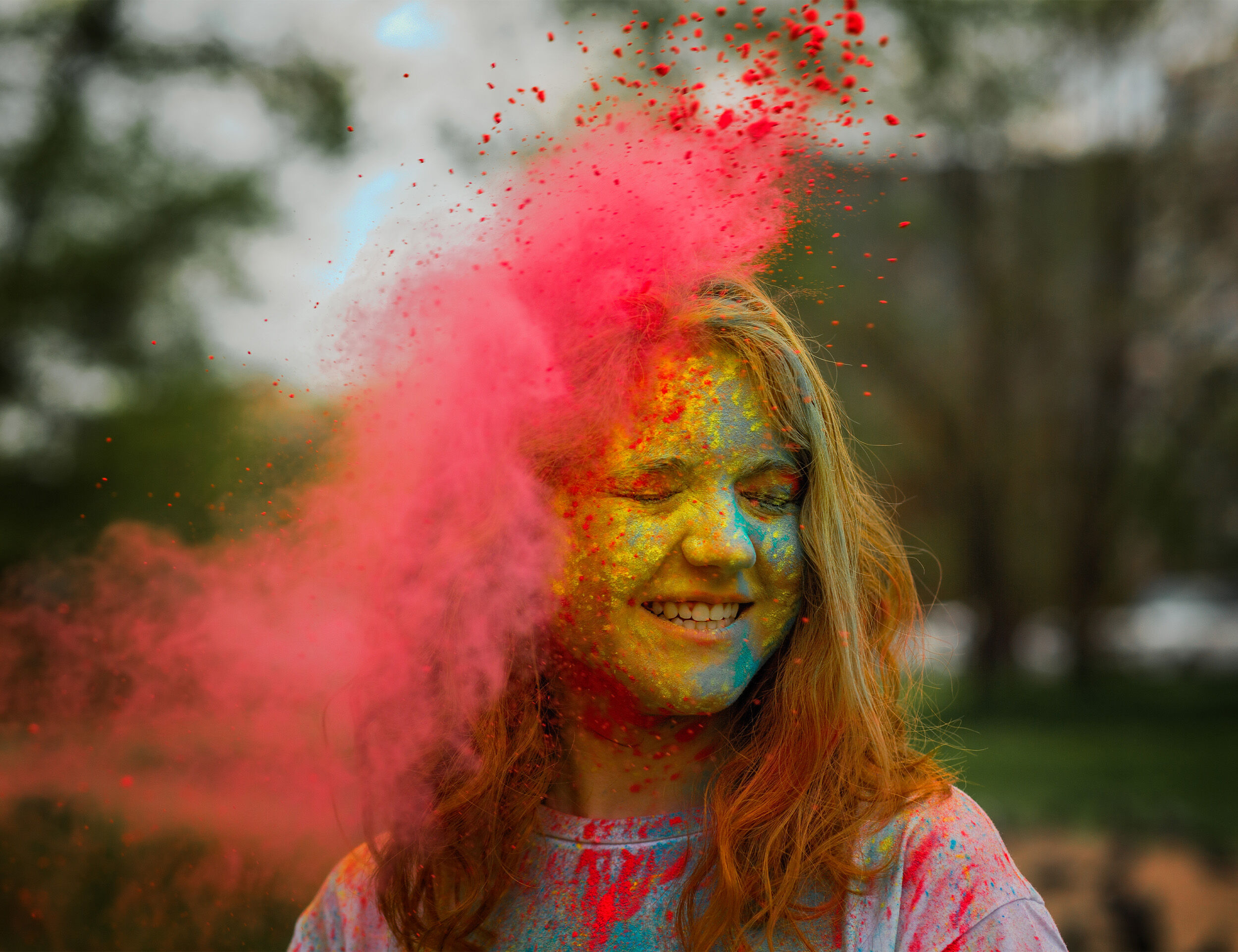 a beautifull women enjoying holi with colours